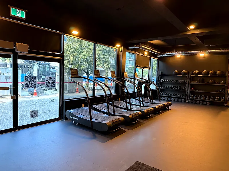 Woodway treadmills and weight racks used for HIIT classes at the Coresa studio in North Vancouver