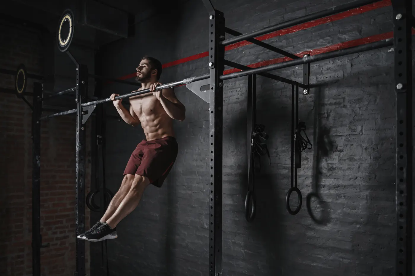 Athlete doing pull-ups at the gym