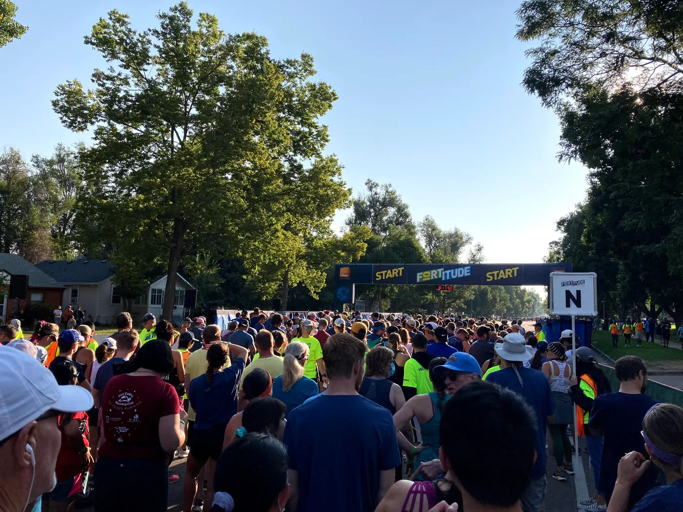 Runners waiting at the start line of a 10K road race